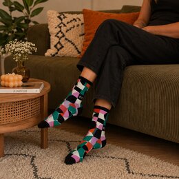 Individuelle farbig gewebte Tennissocken mit Flessler Hotel Logo und Retro Muster